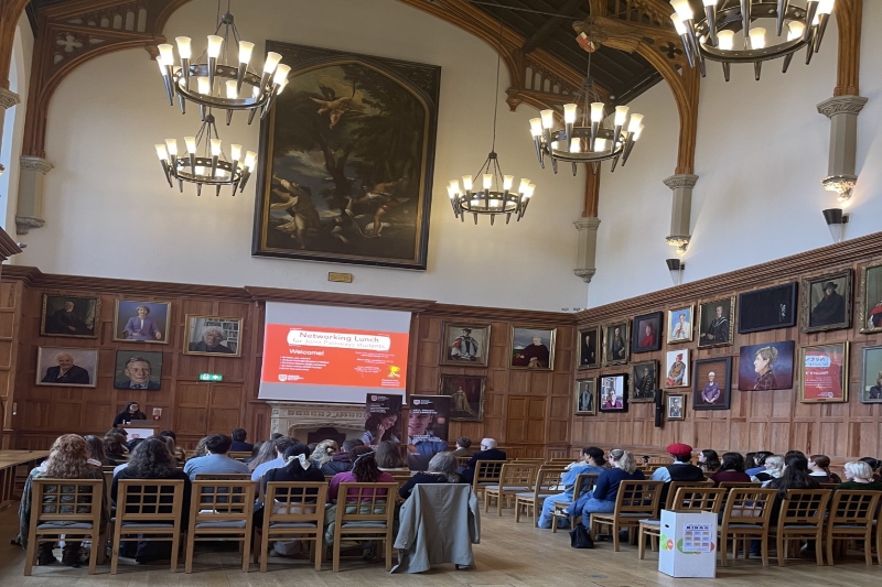 Photo of students in a panelled hall